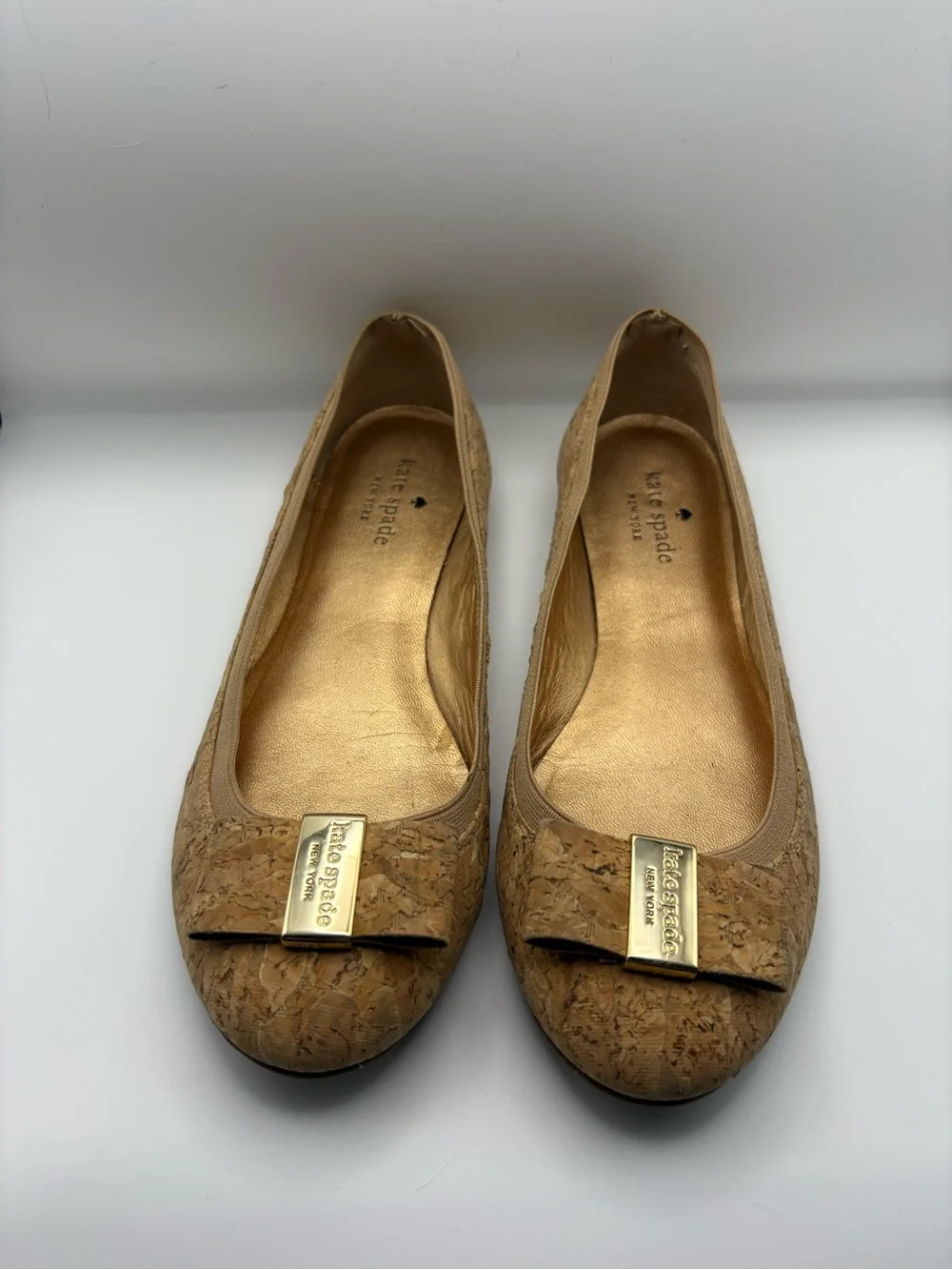 kate spade cork bow flats in tan with gold plaque